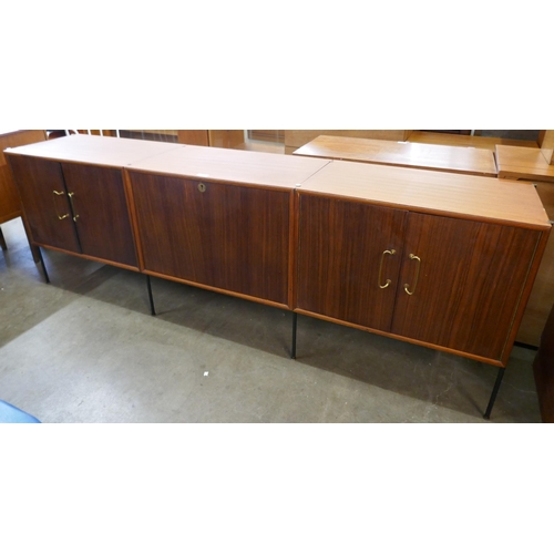 19 - A tola wood fitted three door sideboard