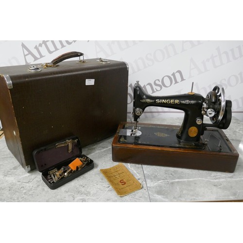 2136 - A vintage Singer EC182136 manually operated sewing machine with wooden hard case