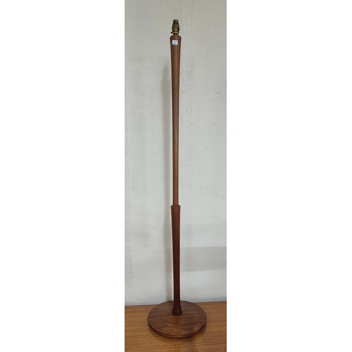 22 - A teak standard lamp