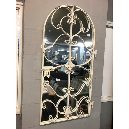 1322 - A garden gate mirror