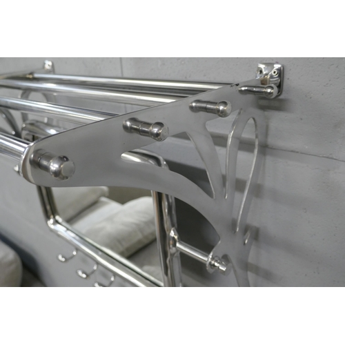 1384 - A polished chrome luggage rack