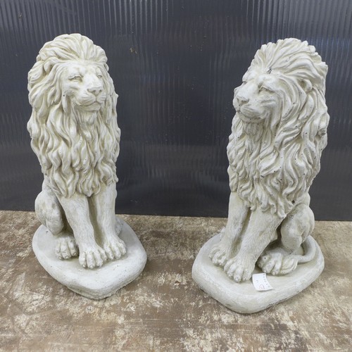 2317 - A pair of small stone effect concrete lion ornaments