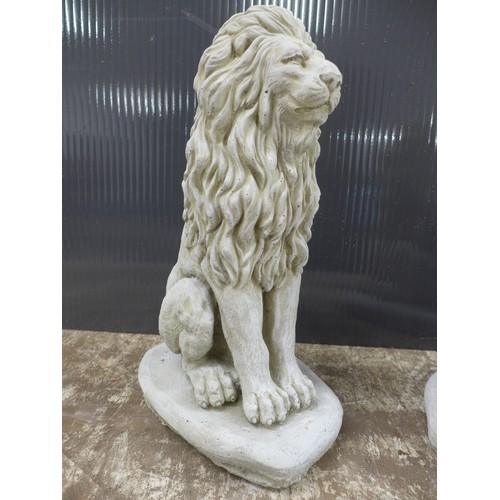 2317 - A pair of small stone effect concrete lion ornaments