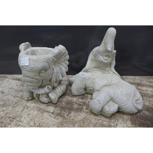 2329 - A pair of stone effect concrete elephant ornaments