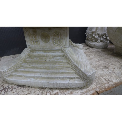 2331A - A stone effect concrete ornament of an oriental four tier pagoda