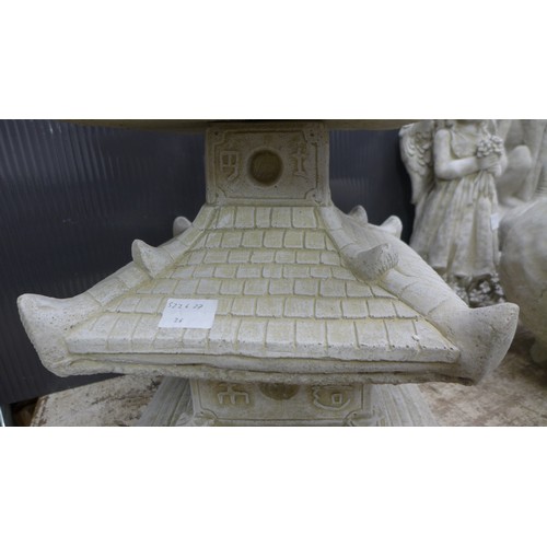 2331A - A stone effect concrete ornament of an oriental four tier pagoda