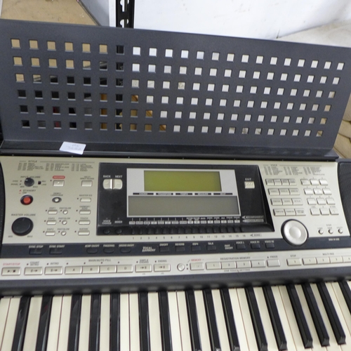 2217 - A Yamaha PSR-740 electronic synthesizer keyboard, keyboard stand and power supply