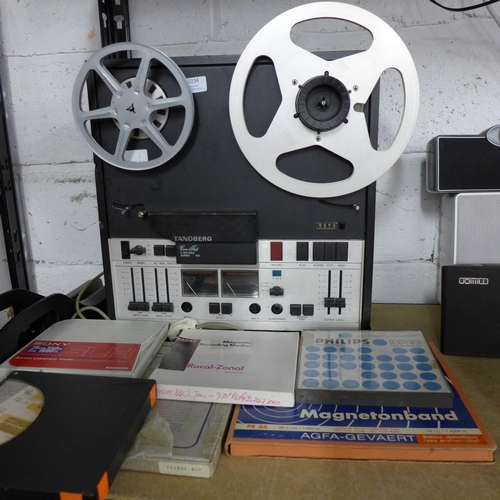 2234 - A Tandberg Crossfield 3 Motors series 10X reel to reel recorder and 9 assorted reel to reel tapes