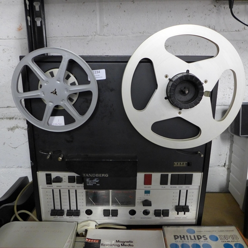 2234 - A Tandberg Crossfield 3 Motors series 10X reel to reel recorder and 9 assorted reel to reel tapes