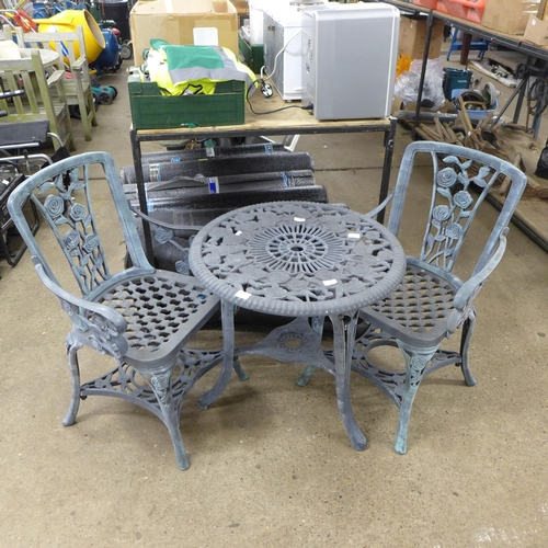 2363 - A grey plastic cast iron effect garden table and 2 chairs