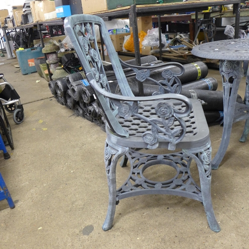 2363 - A grey plastic cast iron effect garden table and 2 chairs