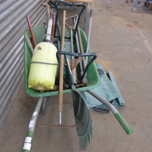 2365 - A plastic wheelbarrow and an assortment of garden tools including lawn edging shears, rakes, branch ... 