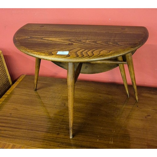 64 - An Ercol Golden Dawn elm and beech drop leaf Windsor coffee table