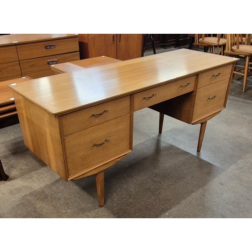 62 - An Alfred Cox walnut desk