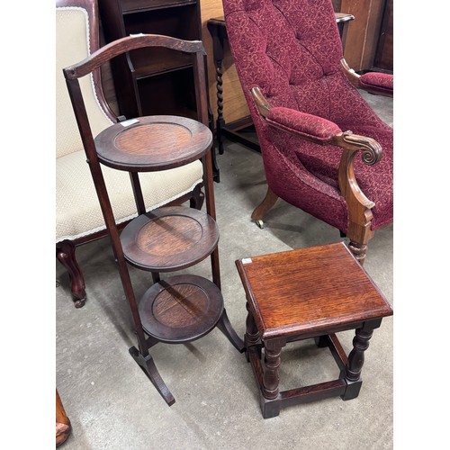 140 - An oak folding cake stand and a stool