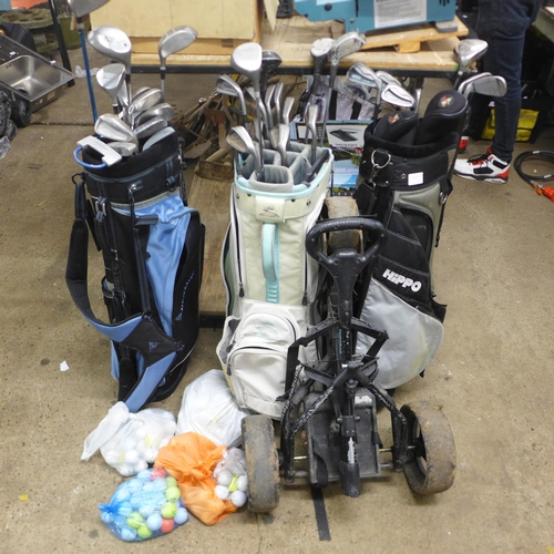 2052 - Three golf bags including a Dunlop, a Cobra and a Hippo bag plus a large quantity of golf clubs incl... 