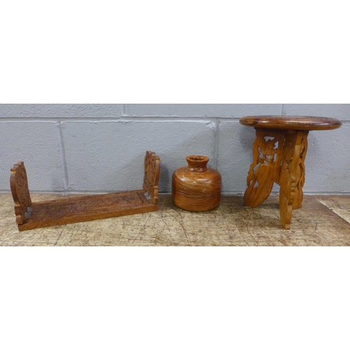 1020 - A carved wooden slide, small table and a wooden bowl