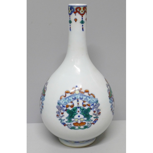 604 - A Chinese porcelain Doucai bottle vase, 22.5cm