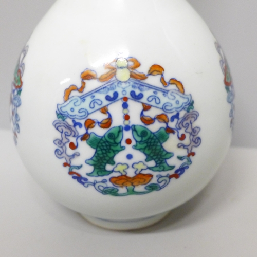 604 - A Chinese porcelain Doucai bottle vase, 22.5cm