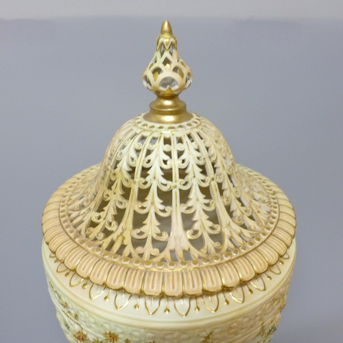 610 - A Grainger's Royal China Works gilt ivory vase and pierced cover, 19th Century (lid discoloured, res... 