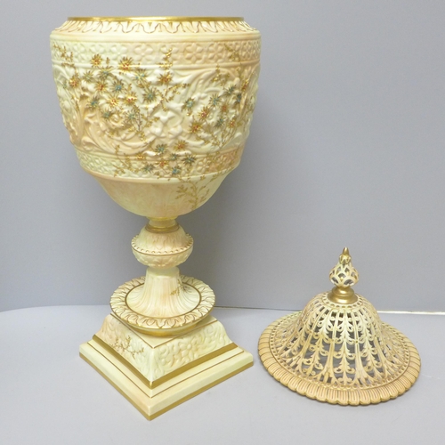 610 - A Grainger's Royal China Works gilt ivory vase and pierced cover, 19th Century (lid discoloured, res... 