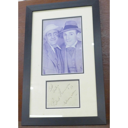 613 - A Flanagan & Allen autograph and photograph display, framed