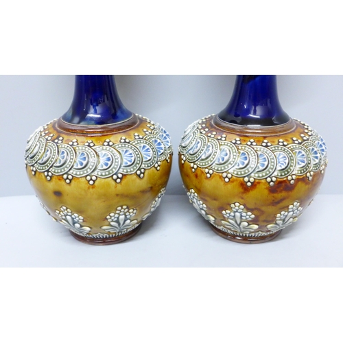 614 - A pair of Doulton Lambeth stoneware vases, impressed marks, 20cm