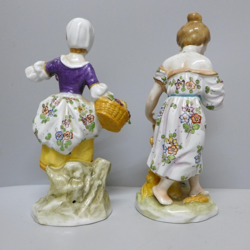 622 - A pair of Sitzendorf continental porcelain figures of ladies, 14.5cm and 15cm