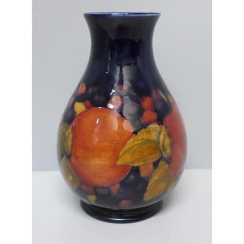 633A - A Moorcroft open pomegranate vase, a/f, chip to base, 12cm