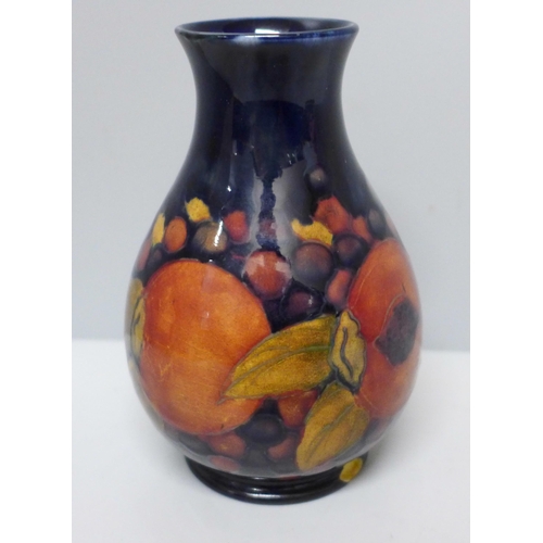 633A - A Moorcroft open pomegranate vase, a/f, chip to base, 12cm