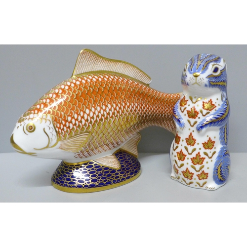 634 - Two Royal Crown Derby paperweights, golden carp and chipmunk, carp with blemish on back and missing ... 