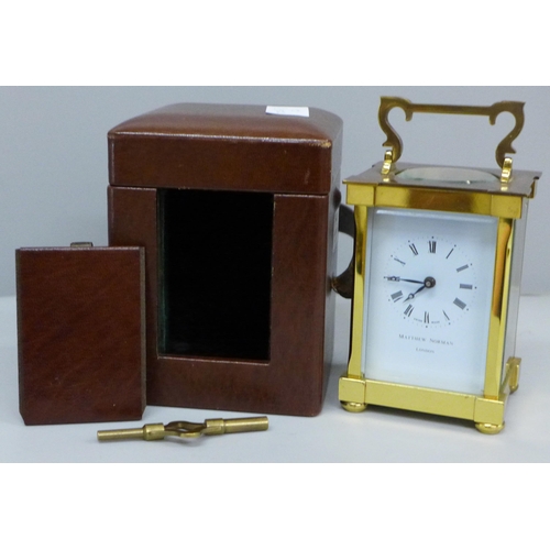 640 - A Matthew Norman London brass and four glass sided carriage clock in a fitted case, with key