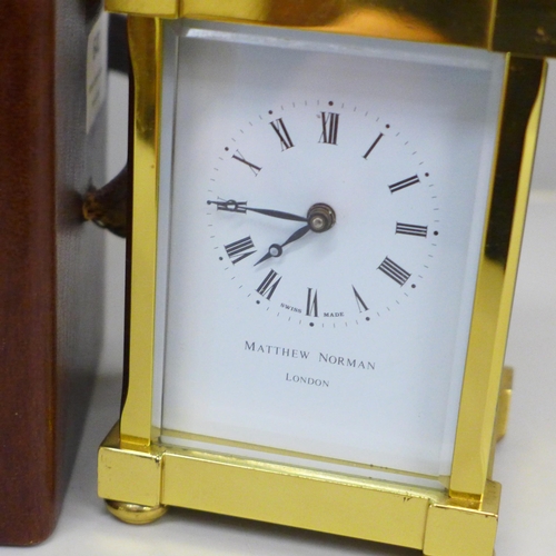 640 - A Matthew Norman London brass and four glass sided carriage clock in a fitted case, with key