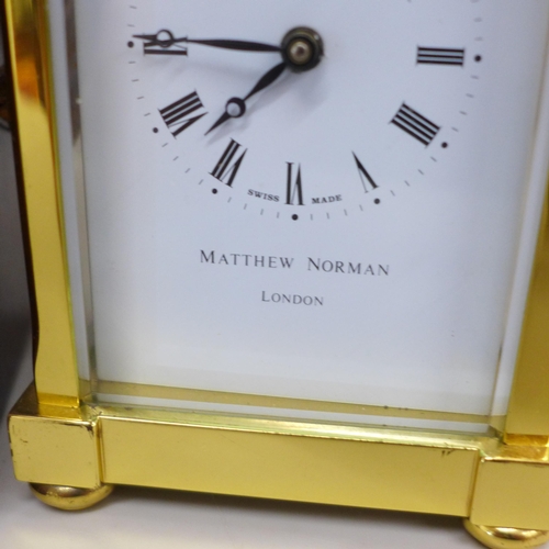 640 - A Matthew Norman London brass and four glass sided carriage clock in a fitted case, with key