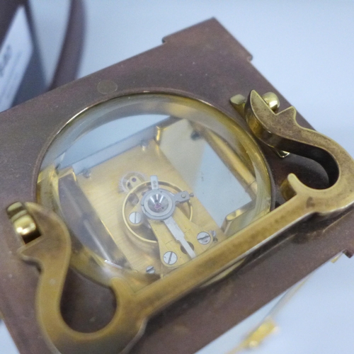 640 - A Matthew Norman London brass and four glass sided carriage clock in a fitted case, with key