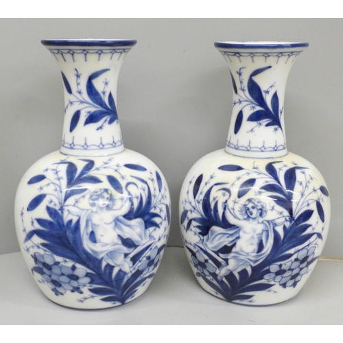 641 - A pair of Delft blue and white vases, 20cm