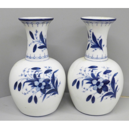 641 - A pair of Delft blue and white vases, 20cm