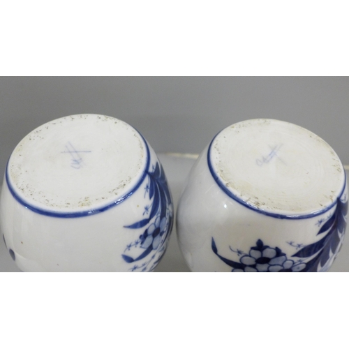 641 - A pair of Delft blue and white vases, 20cm