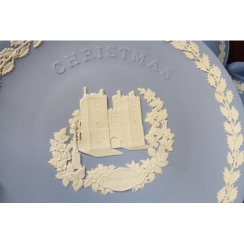 661 - A collection of Wedgwood Jasperware porcelain comprising nine Christmas plates, seven trinket dishes... 