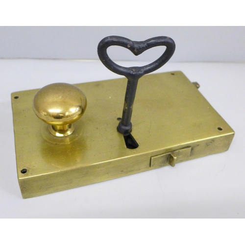 673 - A brass door lock with key