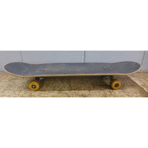 750 - A 1980s skateboard with Venture skateboard trucks