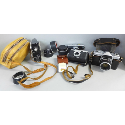 751 - A Kowa Company SLR camera, with additional lens, Olympus Trip 35 camera, Comet camera, light meter a... 