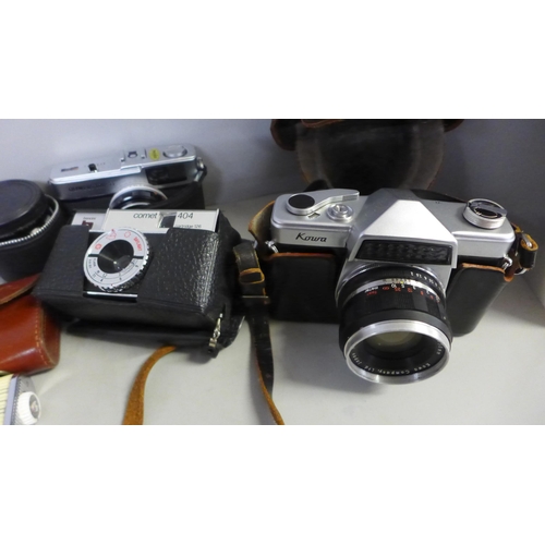 751 - A Kowa Company SLR camera, with additional lens, Olympus Trip 35 camera, Comet camera, light meter a... 