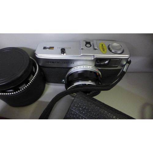 751 - A Kowa Company SLR camera, with additional lens, Olympus Trip 35 camera, Comet camera, light meter a... 