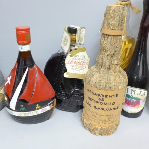 785 - A bottle of Old Brigand Barbados rum, a bottle of Descobrimento Licor, a bottle of Mandarina and eig... 