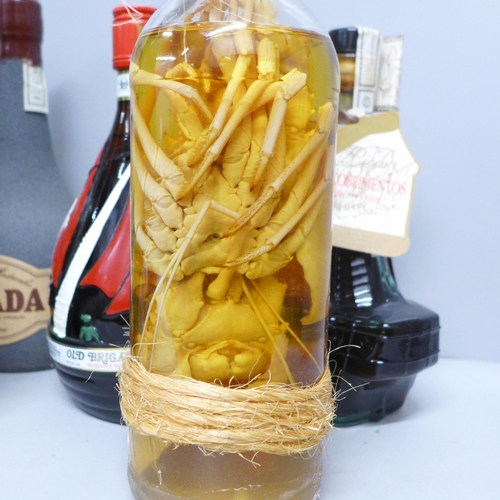 785 - A bottle of Old Brigand Barbados rum, a bottle of Descobrimento Licor, a bottle of Mandarina and eig... 