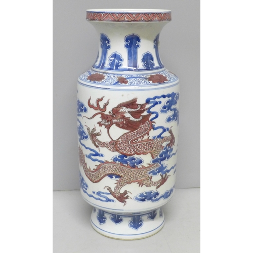 795 - A Chinese porcelain vase with dragon and cloud detail, six character mark to base, 34.5cm