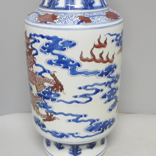 795 - A Chinese porcelain vase with dragon and cloud detail, six character mark to base, 34.5cm