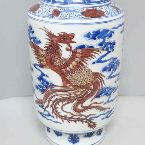 795 - A Chinese porcelain vase with dragon and cloud detail, six character mark to base, 34.5cm