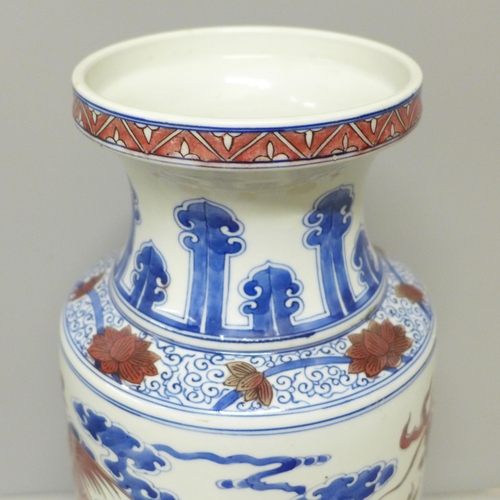 795 - A Chinese porcelain vase with dragon and cloud detail, six character mark to base, 34.5cm